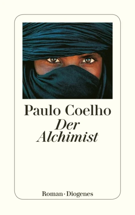 Buchumschlag von "Der Alchemist" mit einem geheimnisvollen, verhüllten Gesicht.